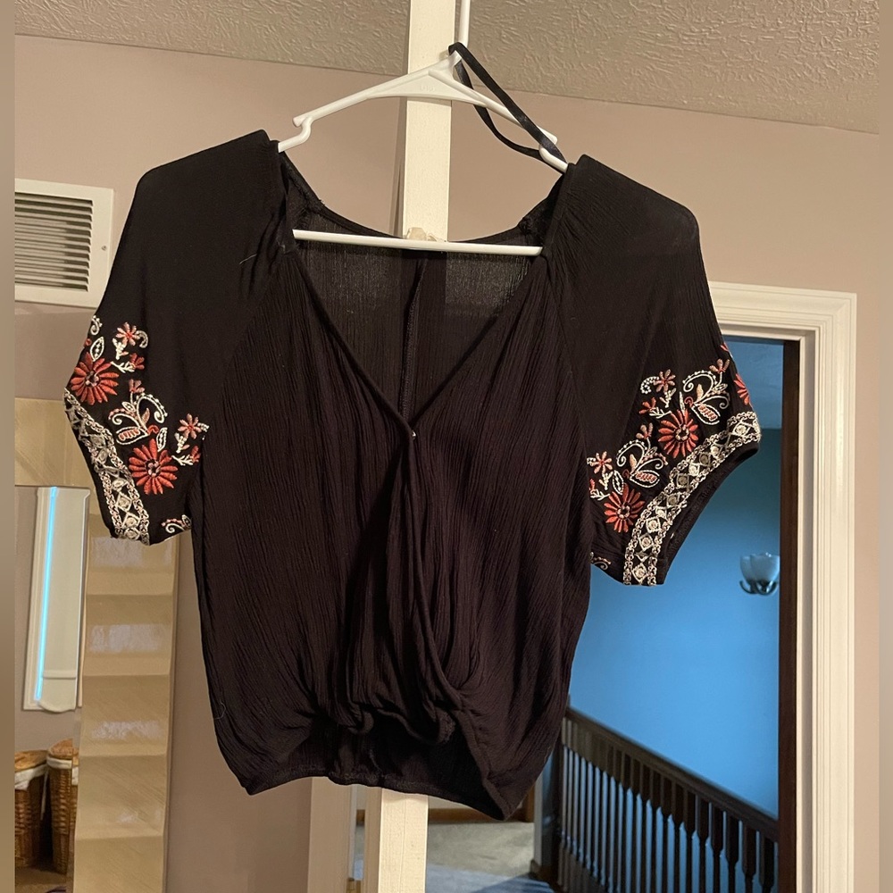 Floral sleeve black top